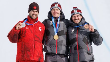 LIVIGNO,ITALY,12.FEB.26 - OLYMPICS, SNOWBOARD - Winter Olympic Games Milano Cortina 2026, Snowboard Cross, men, final, medal ceremony. Image shows Eliot Grondin (CAN), Alessandro Haemmerle and Jakob Dusek (AUT). Keywords: medals Photo: GEPA pictures/ Harald Steiner