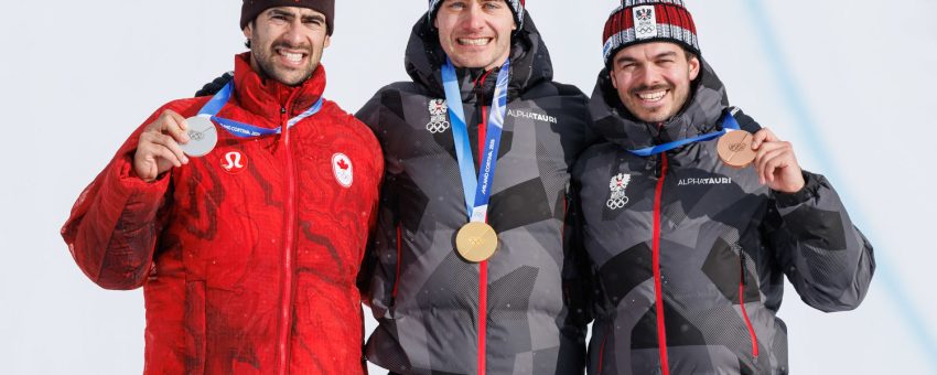 LIVIGNO,ITALY,12.FEB.26 - OLYMPICS, SNOWBOARD - Winter Olympic Games Milano Cortina 2026, Snowboard Cross, men, final, medal ceremony. Image shows Eliot Grondin (CAN), Alessandro Haemmerle and Jakob Dusek (AUT). Keywords: medals Photo: GEPA pictures/ Harald Steiner